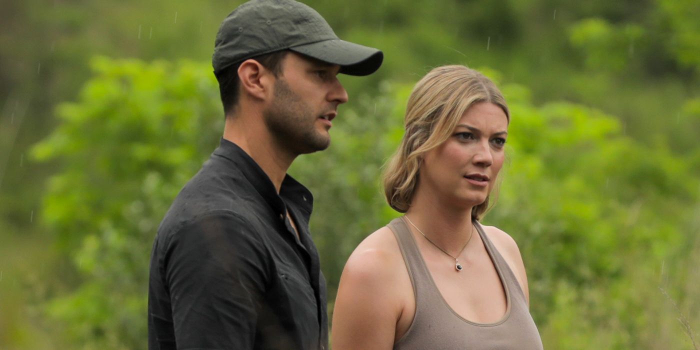 Phil Torres and Heather Amaro looking at something in Expedition X.