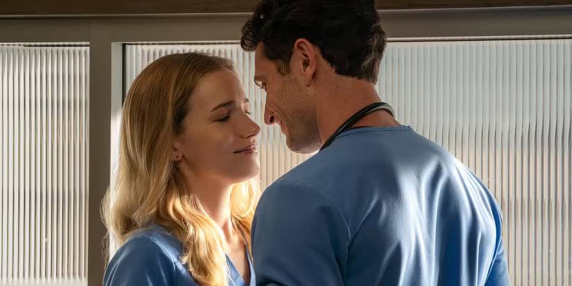 Fitzgerald and Woodell are dressed in blue ER slacks as they move in for a kiss in the stairway.