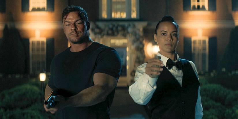 Jack Reacher (Alan Ritchson) holding a gun, while Frances Neagley (Maria Sten) has a grenade in her hand in Reacher Season 3 Ep 8