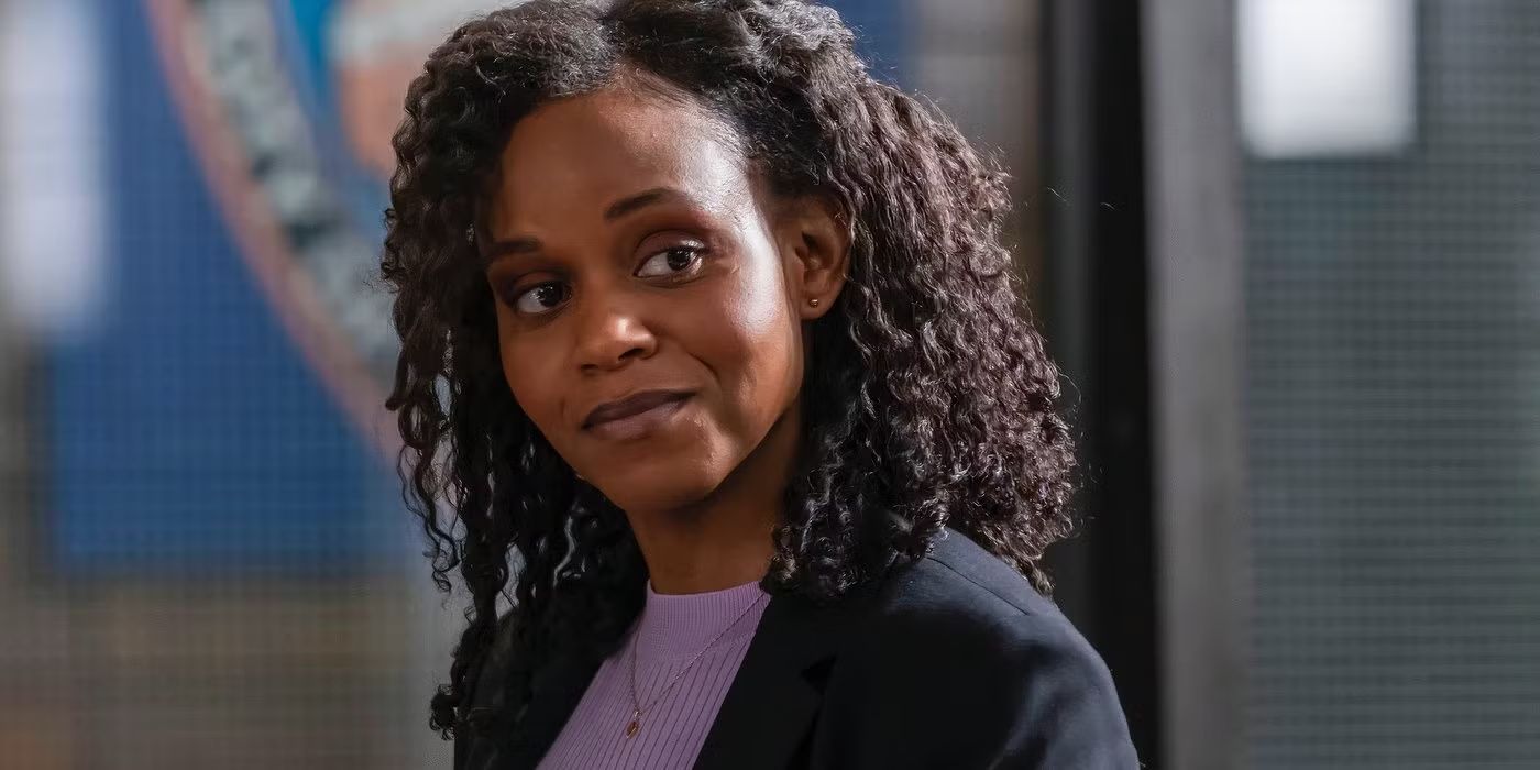 Renee Curry (Aime Donna Kelly) smiling happily in Law & Order SVU.