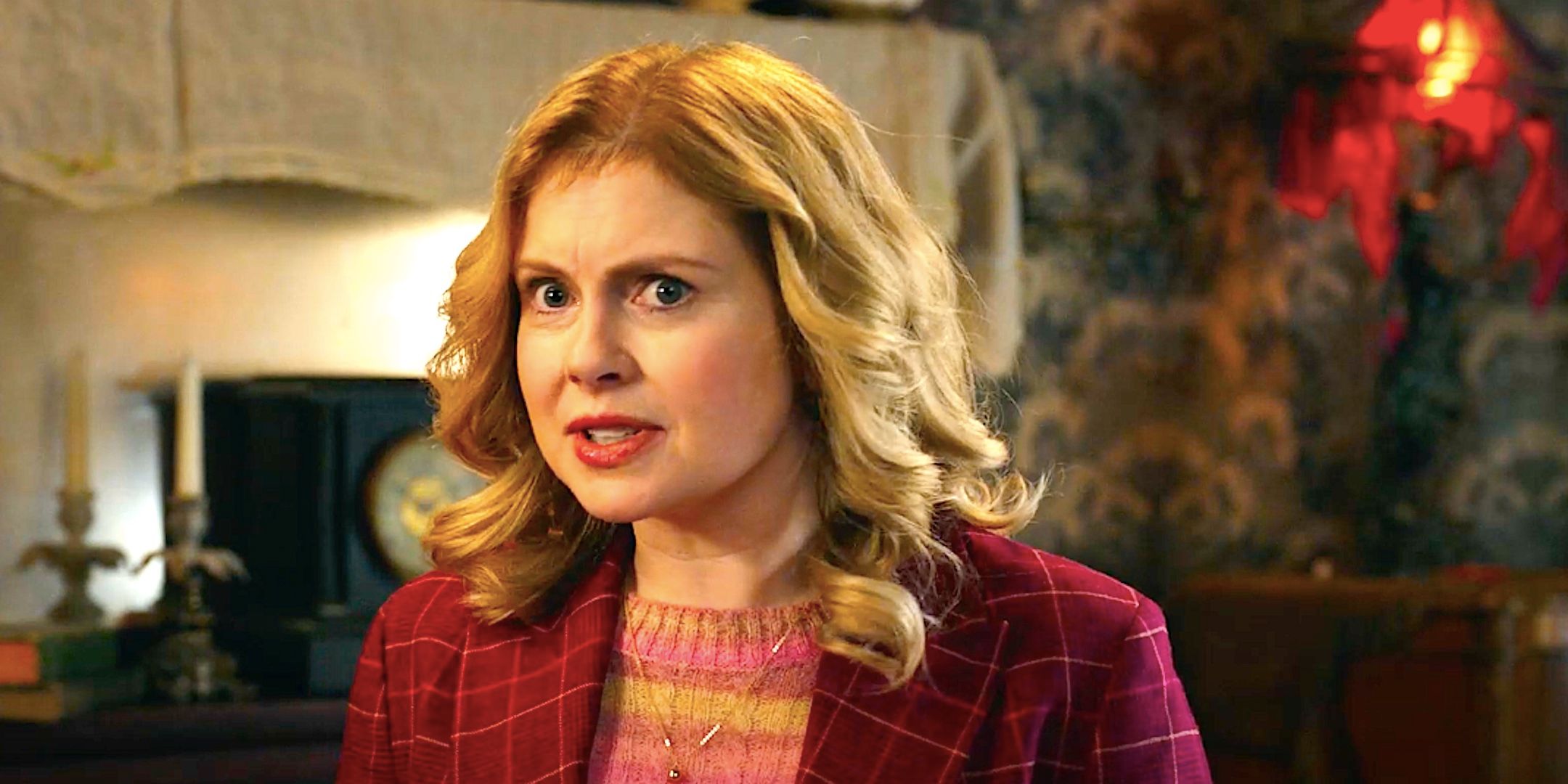 Rose McIver&rsquo;s Sam stands talking in a living room from Ghosts season 4 episode 15