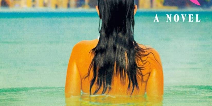 Saltwater Cover featuring a woman with a bare back and dark hair emerged in water and facing away from us
