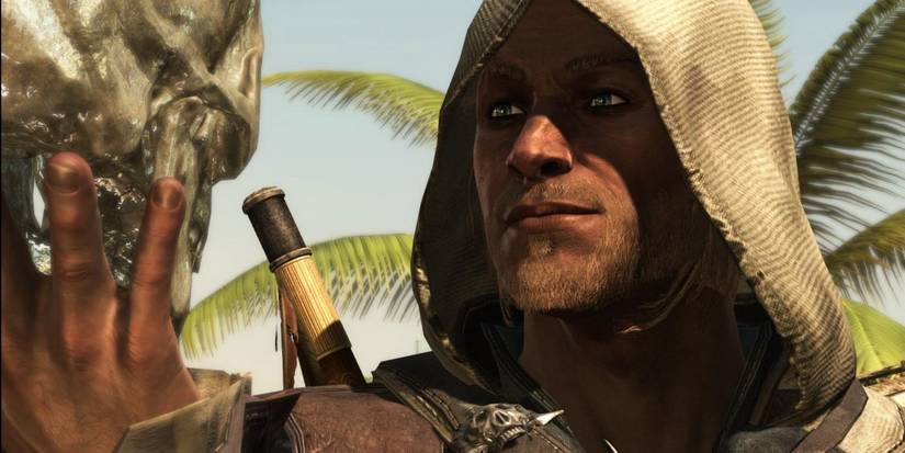 Edward Kenway looking at a skull in Assassin's Creed 4 Black Flag.