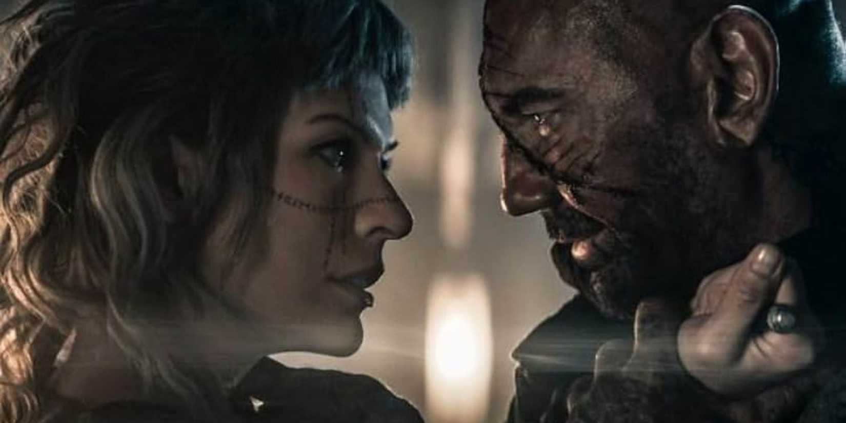 Dave Bautista and Milla Jovovich face one another in In the Lost Lands