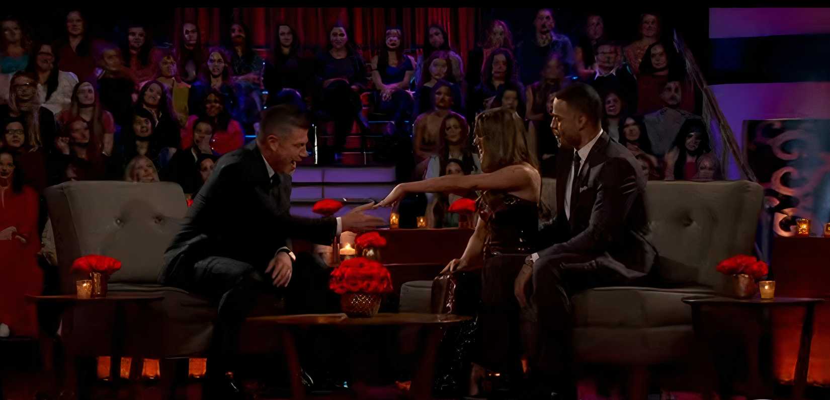 Juliana Pasquarosa sitting on a couch with Grant Ellis, showing off her engagement ring to Jesse Palmer