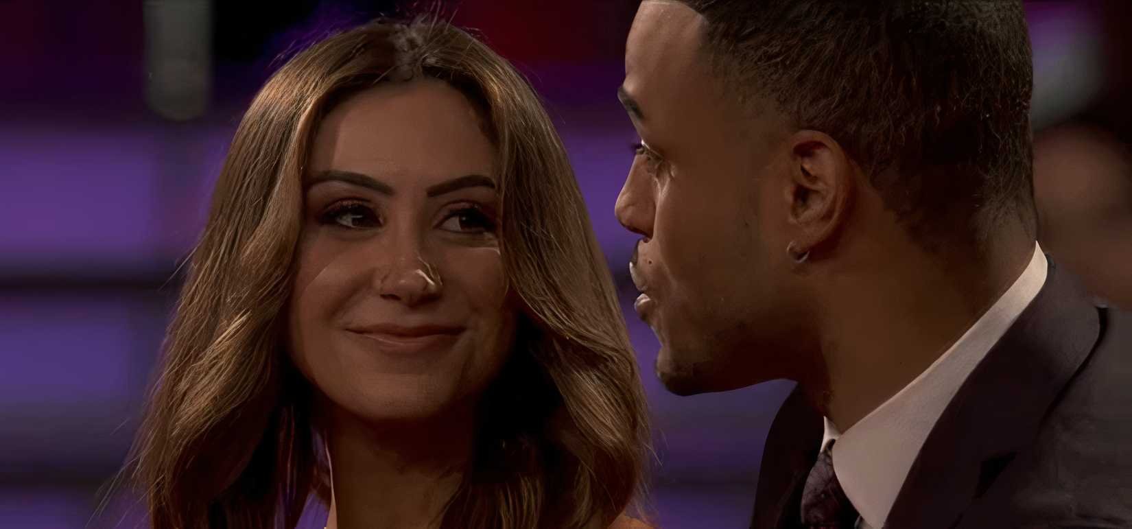A close up of Juliana Pasquarosa smiling at Grant Ellis on The Bachelor