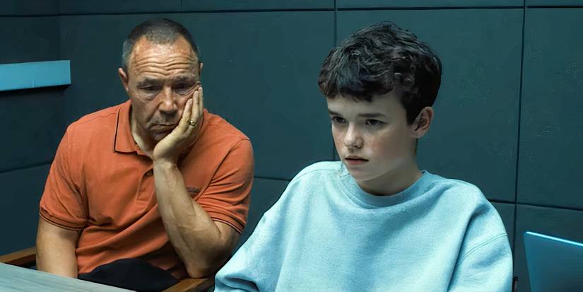 Sephen Graham and Owen Cooper behind a table in Adolescence