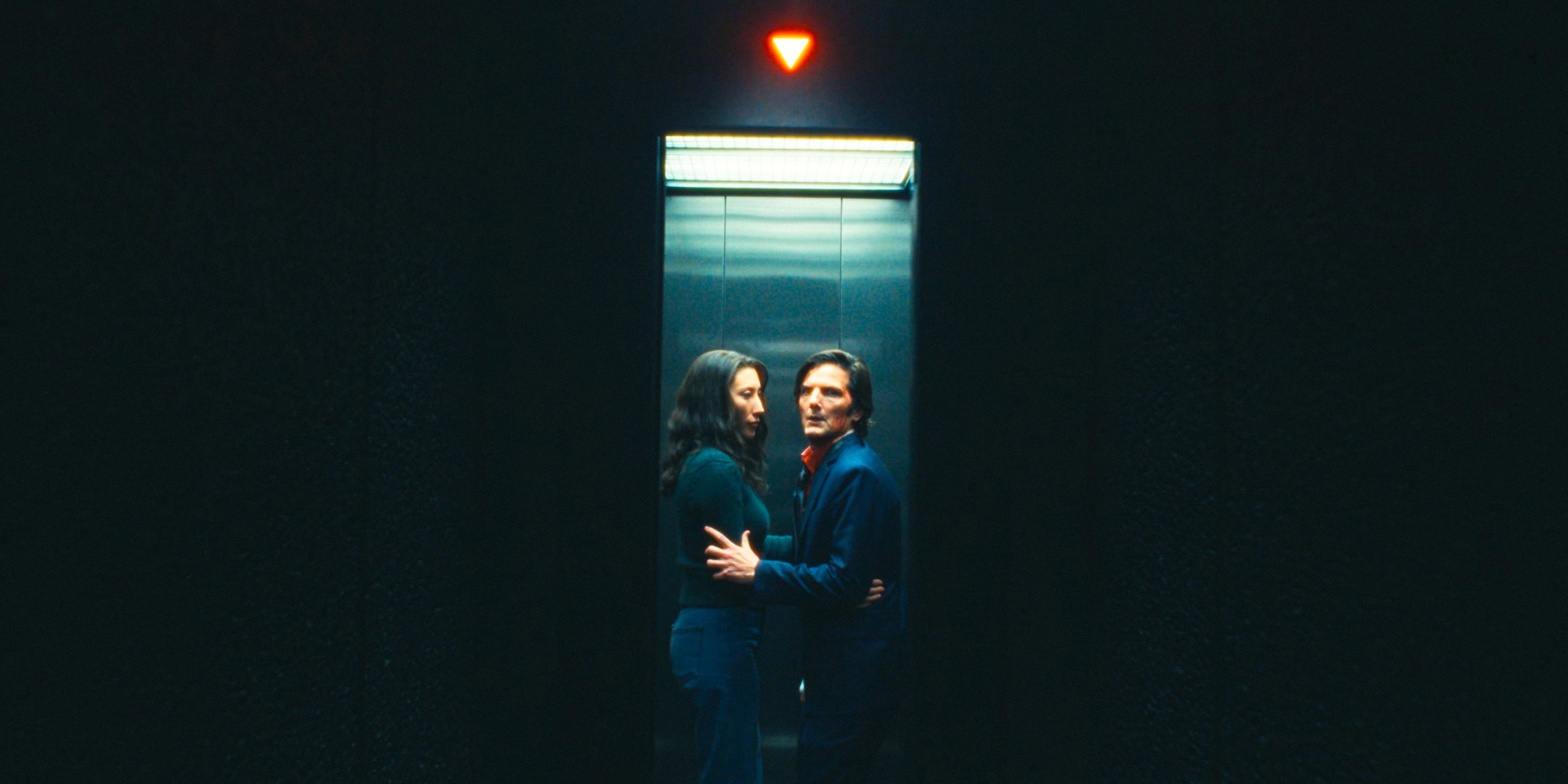 Gemma and Mark S. inside the elevator with the arrow pointing down in Severance Season 2 Ep 10