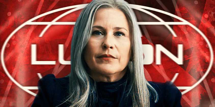 Patricia Arquette as Ms. Cobel in Severance (2022-) above a red background featuring the Lumon logo