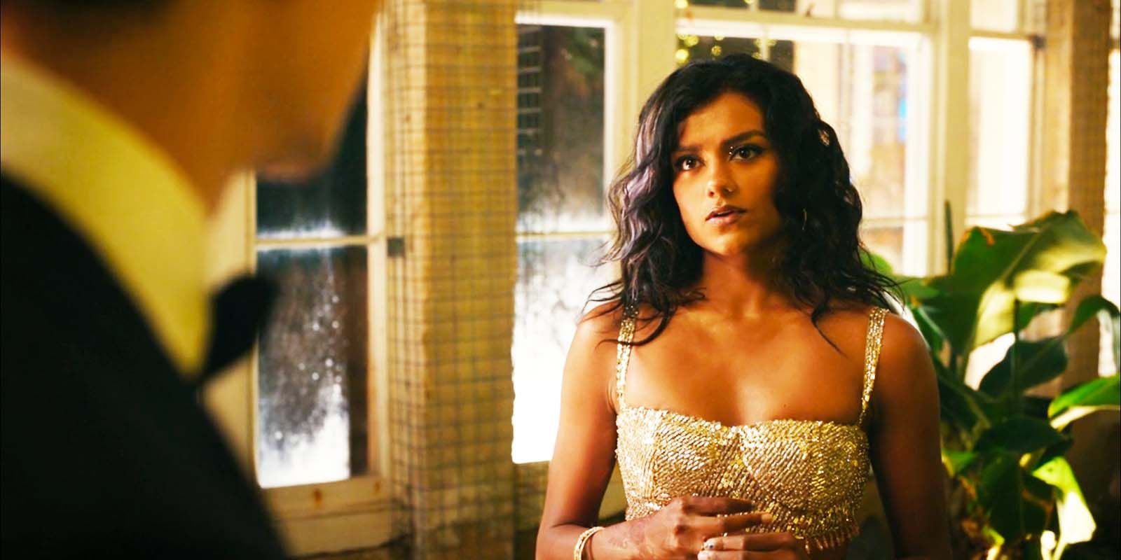 Simone Ashley as Pia looking softly forward in Picture This
