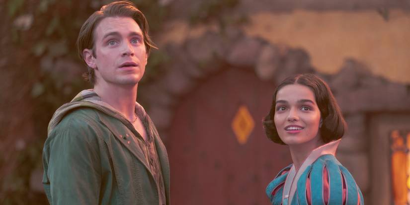 Snow White and Jonathan hold hands in front of the cottage in Snow White 2025