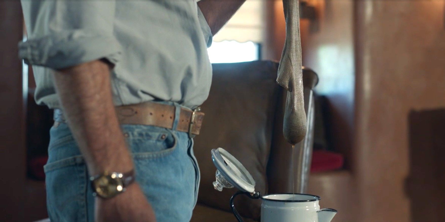Tom Spenser (Bruce Greenwood) using a sock as a coffee filter in Dark Winds season 3, episode 3