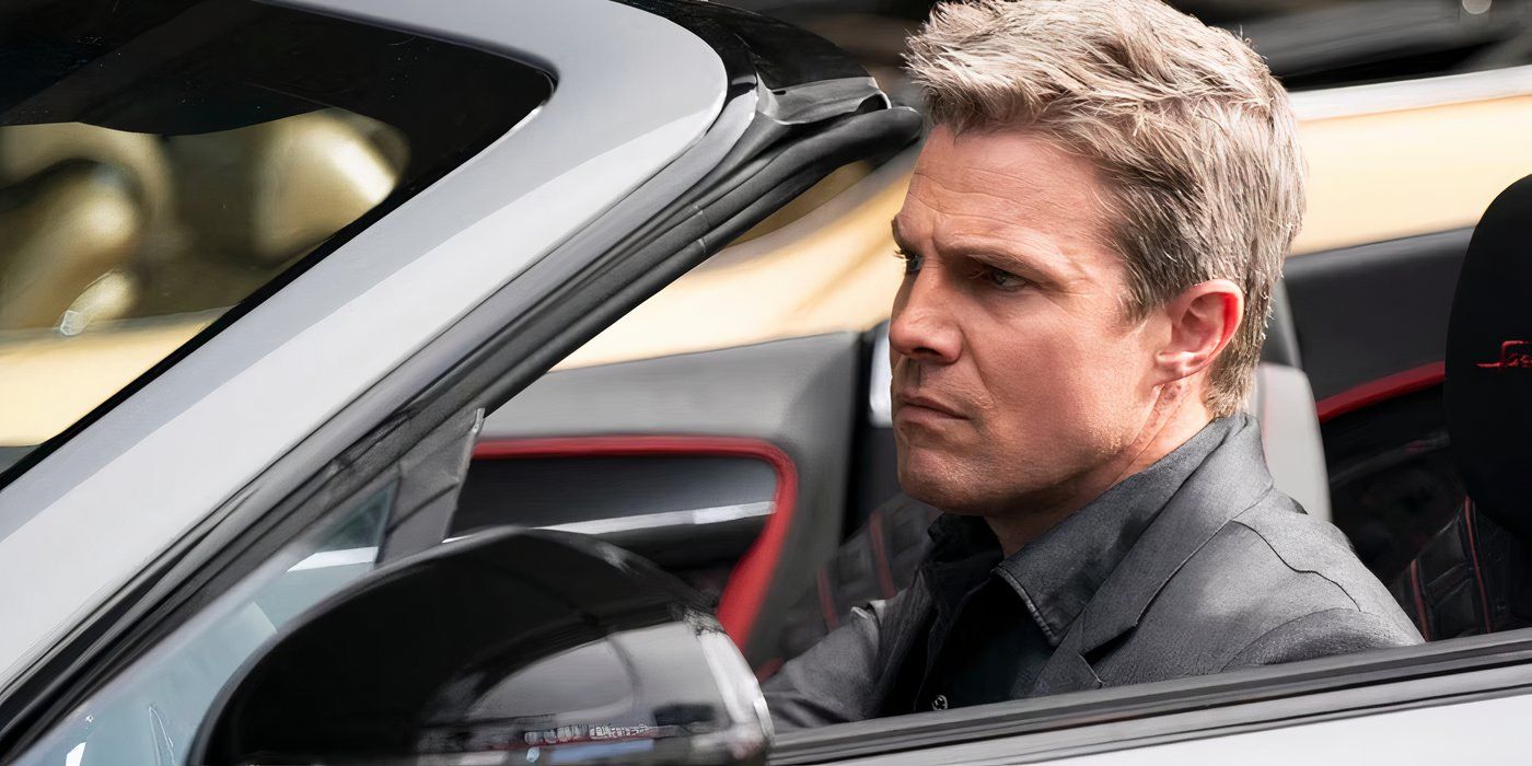stephen amell looks ahead while driving in suits la