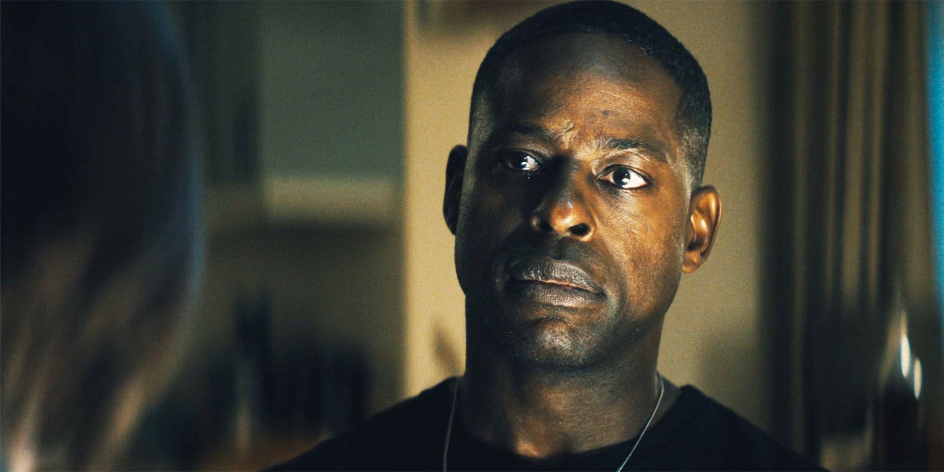 Sterling K Brown as Xavier talking someone, looking uncertain, in Paradise