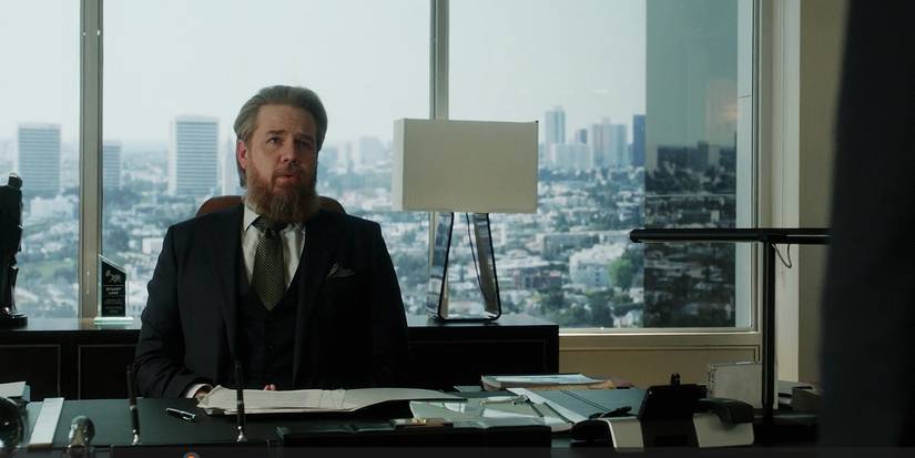 Stuart Lane by his desk in Suits LA episode 5