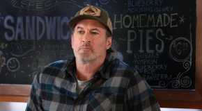 Sully looks angry while standing behind the counter in Sullivan's Crossing