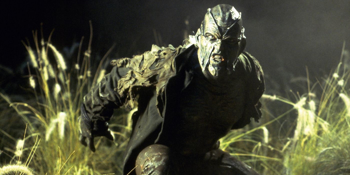 The Creeper jumping out of a field in Jeepers Creepers 4.