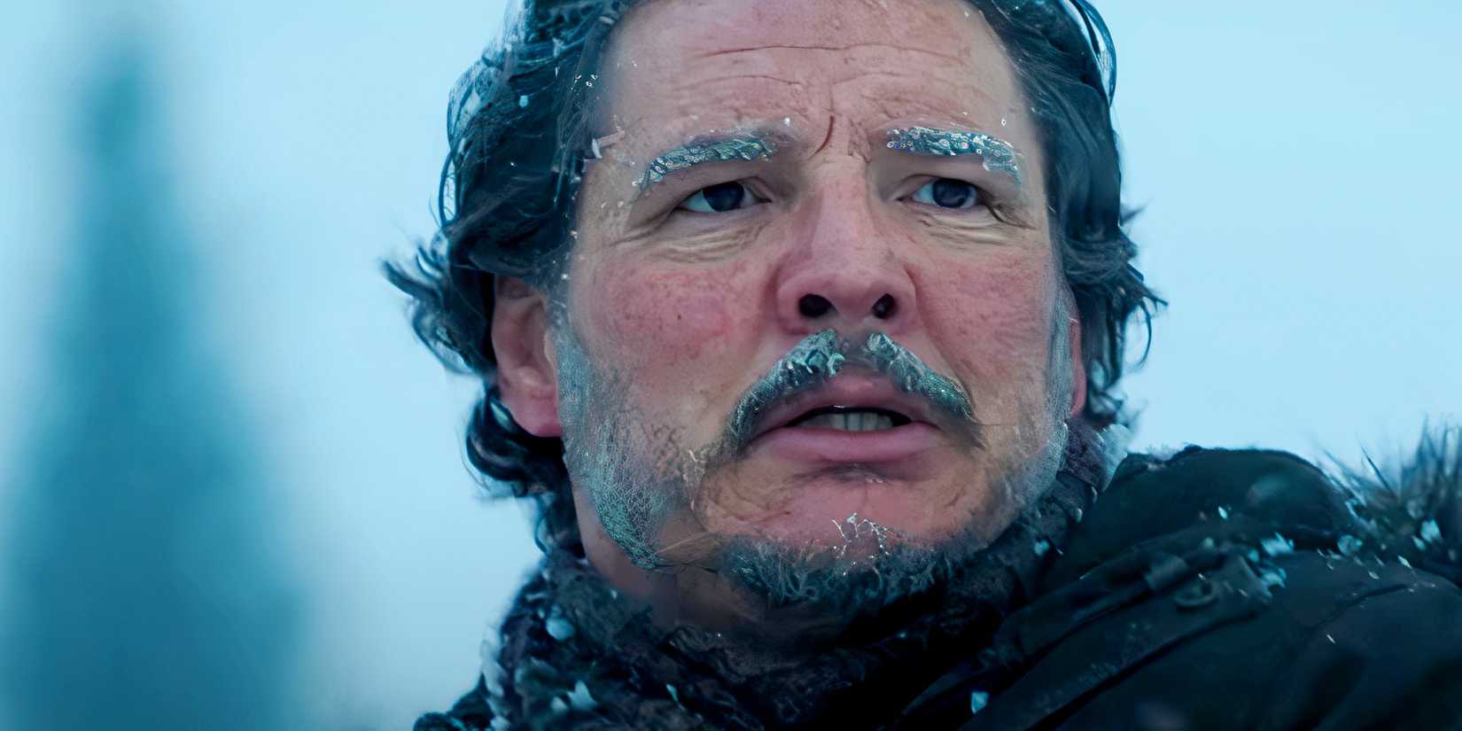 Pedro Pascal looking worried as Joel in the snow in The Last of Us season 2