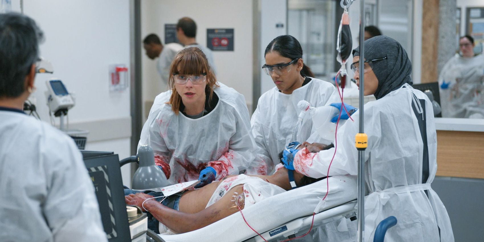 Dr. McKay, Dr. Victoria Javadi, and Perlah Alawi urgently treating a patient in The Pitt Season 1 Ep 12