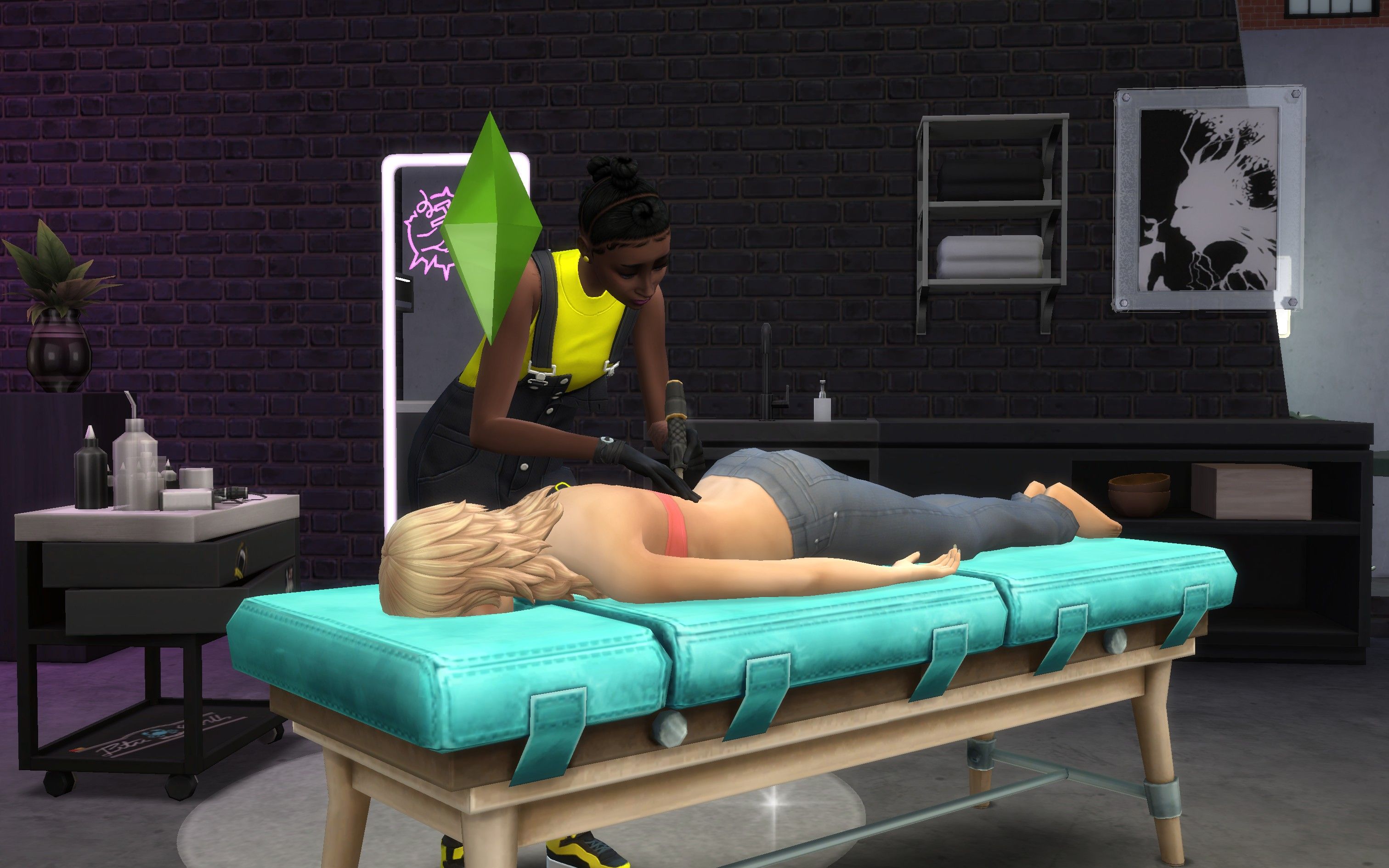The Sims 4 Businesses &amp; Hobbies a Sim on a tattoo table receiving a tattoo from another Sim on their back.