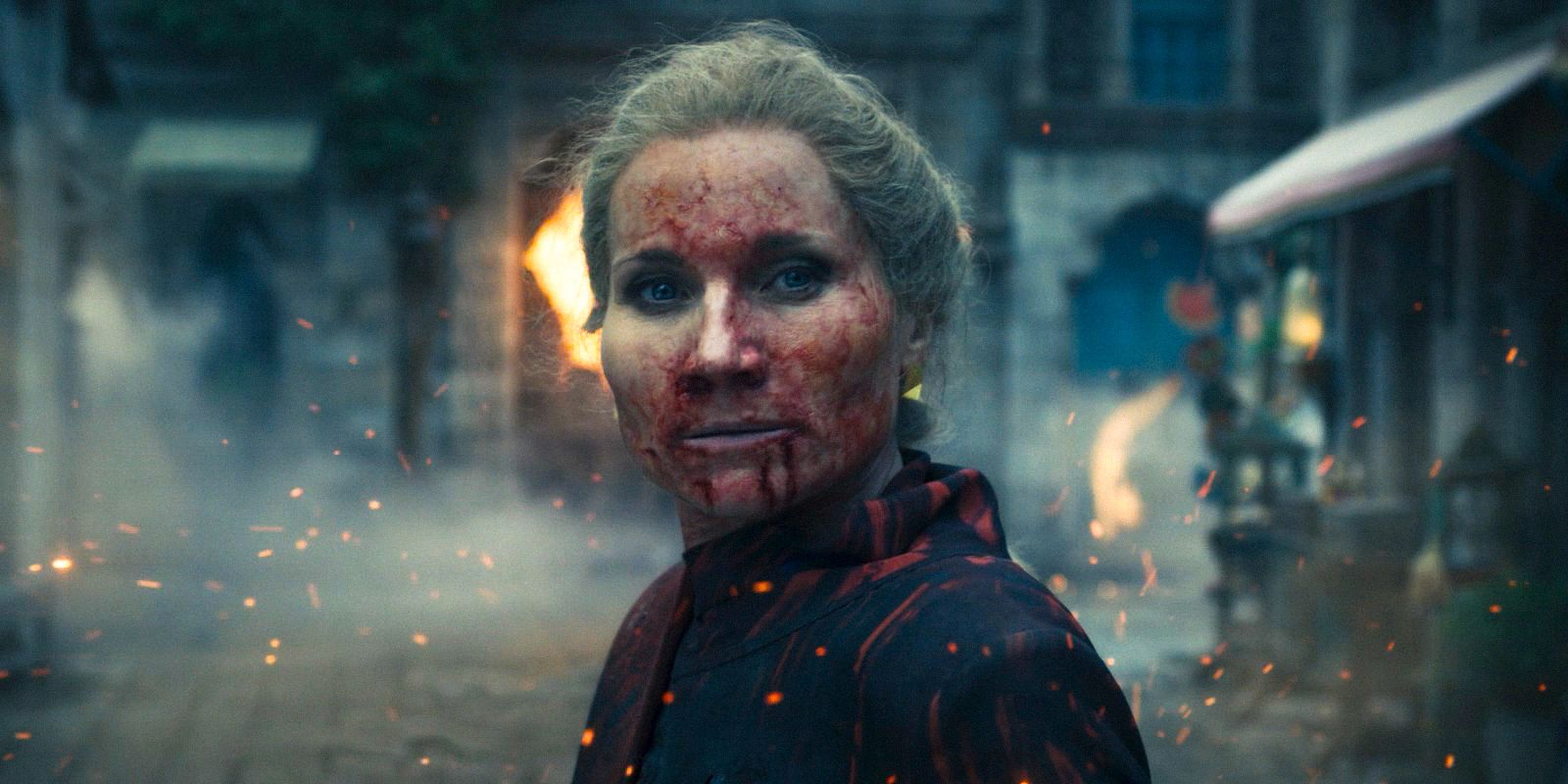 Liandrin Guirale (Kate Fleetwood) with her face splattered with blood in The Wheel of Time Season 3 Ep 1