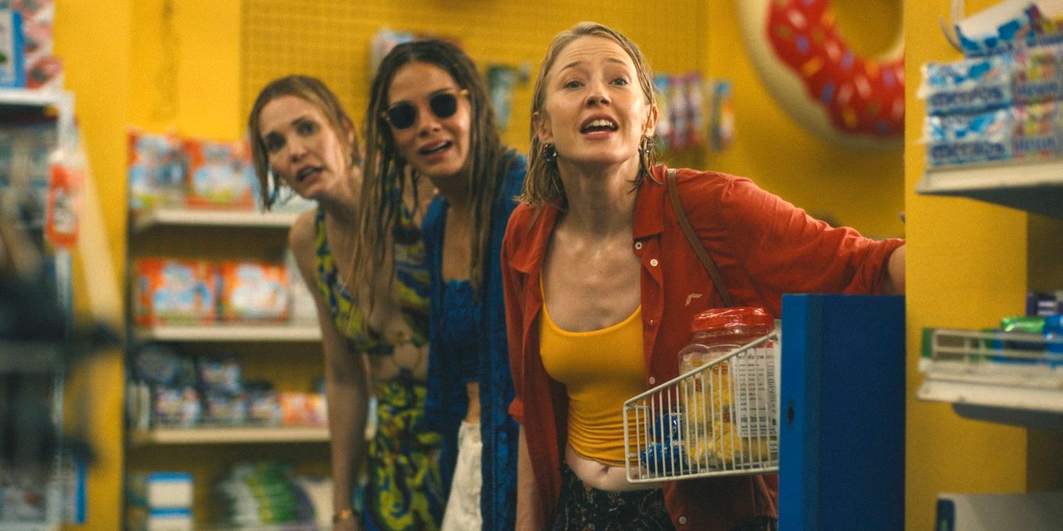 Kate (Leslie Bibb), Jaclyn (Michelle Monaghan) and Laurie (Carrie Coon) take refuge in a convenience store from the water fight in The White Lotus Season 3 Ep 4