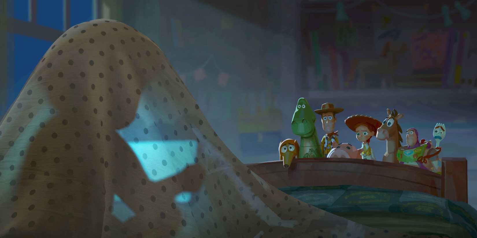 Toy Story 5's first image shows Bonnie on a tablet under her bedsheets while the toys look sadly on