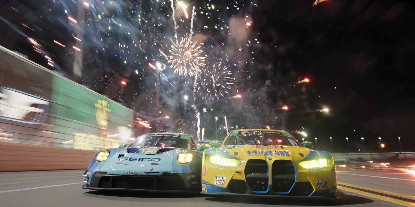 Two cars racing with fireworks behind them in F1