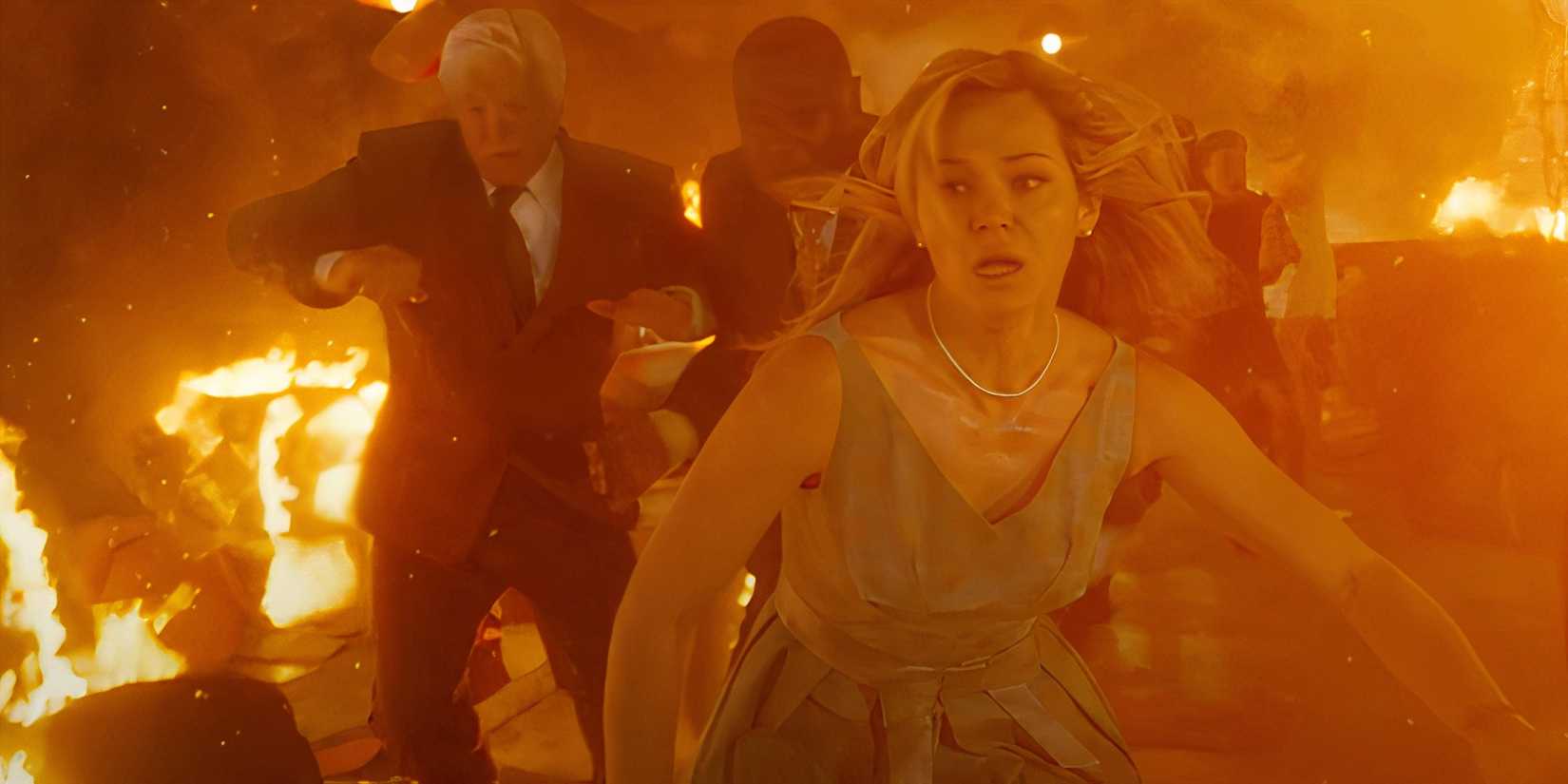 Brec Bassinger as Iris looking scared and running through a fiery setting in Final Destination Bloodlines