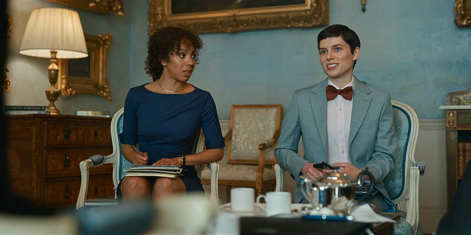 Actors Pearl Mackie and Jess Chanliau sitting next to each other in The Diplomat