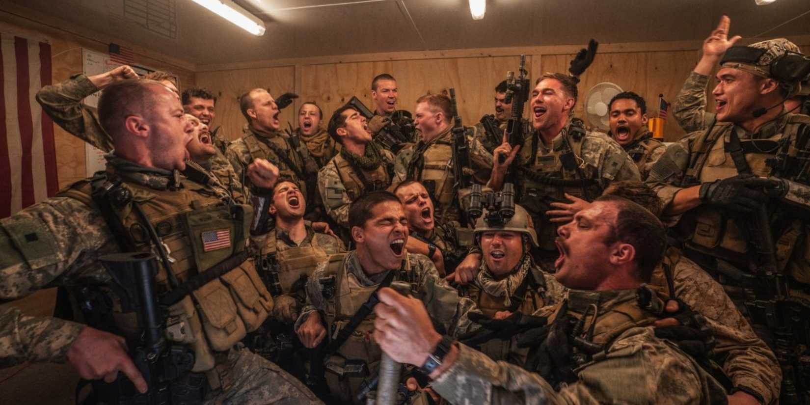 The cast of Warfare screaming while watching a tv monitor
