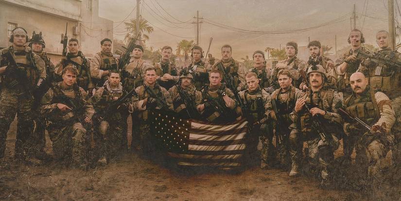 A group of soldiers taking a photo with the flag in Warfare