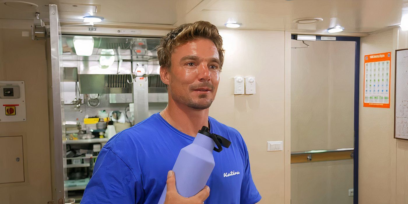 Wihan du Toit holding a purple water bottle in the galley on Below Deck