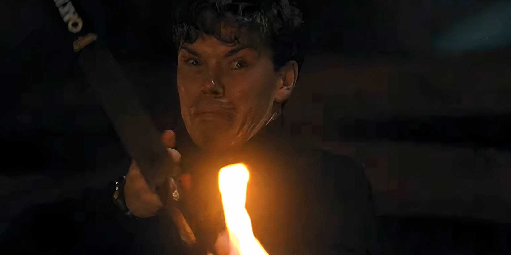 Will Poulter's Shep looking sad while aiming a fiery bow and arrow in Death of a Unicorn