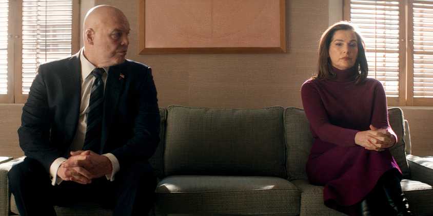 Wilson Fisk looks at Vanessa on a couch in Daredevil Born Again
