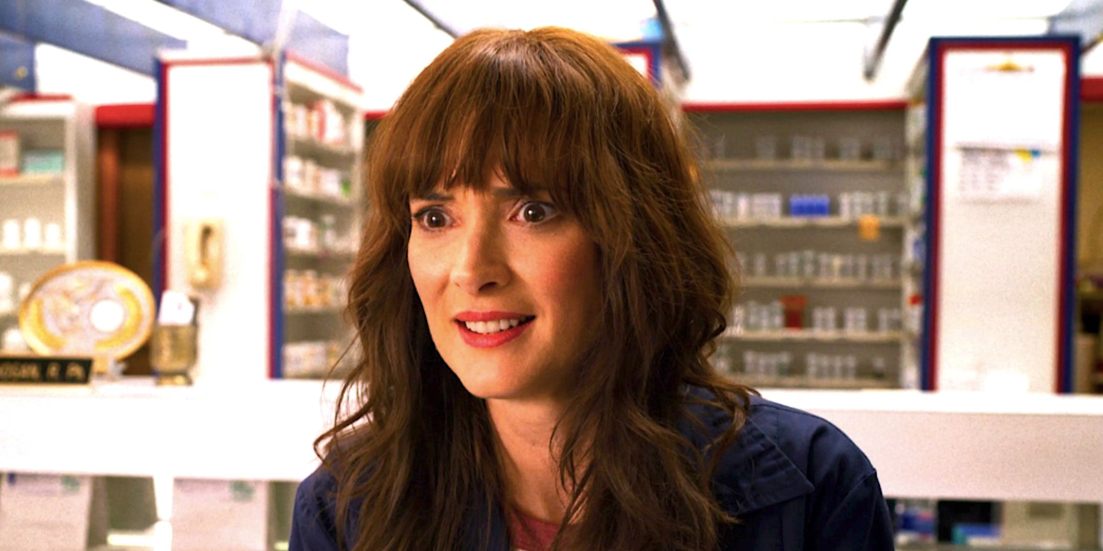 winona ryder s joyce smiles in a store in stranger things season 3