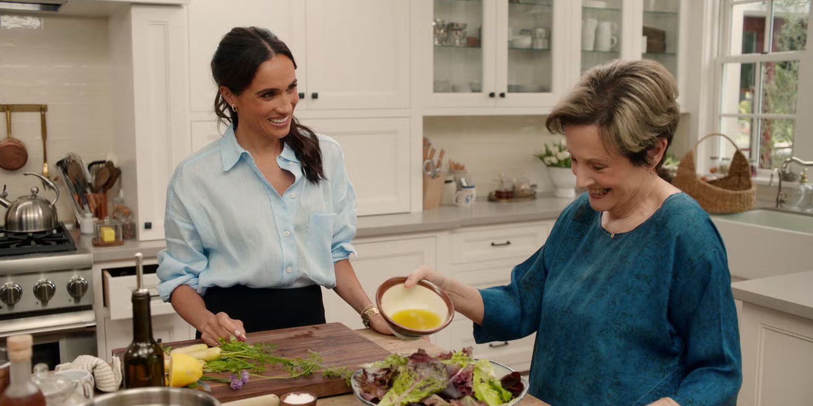 Meghan Markle with a guest on the set of With Love, Meghan.