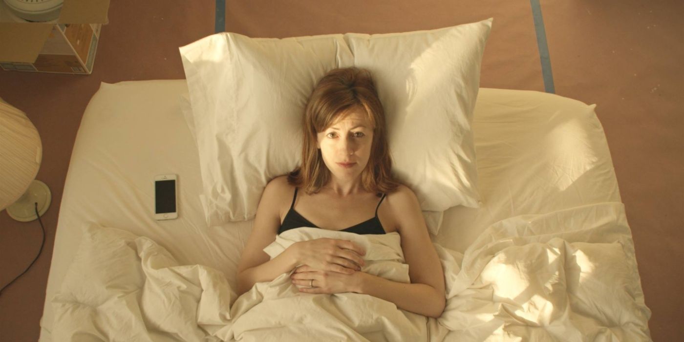 Woman in bed in the short film the ceiling fan