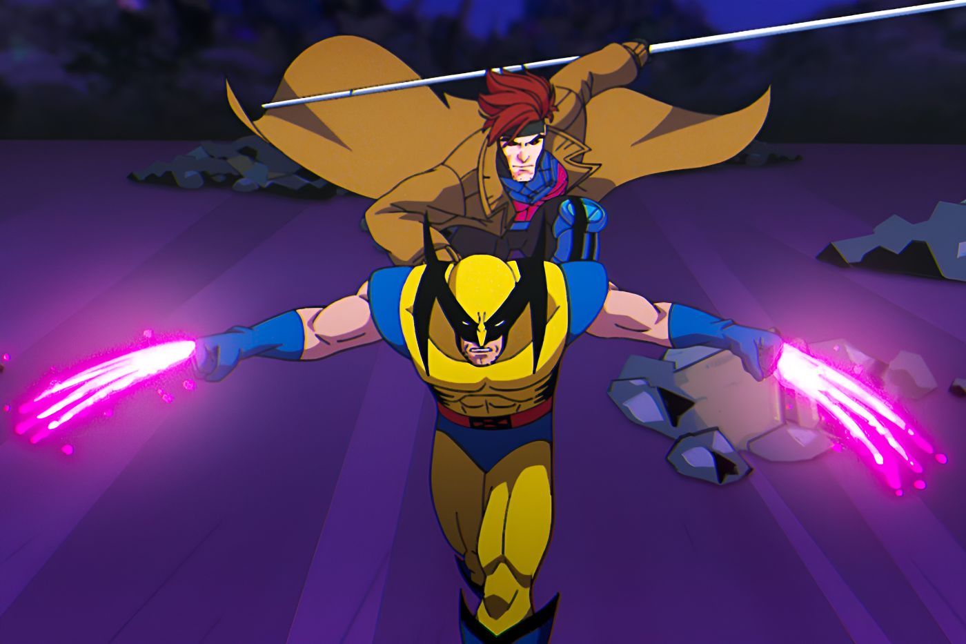Gambit rides Wolverine&rsquo;s back as Wolverine&rsquo;s claws glow a bright purple.