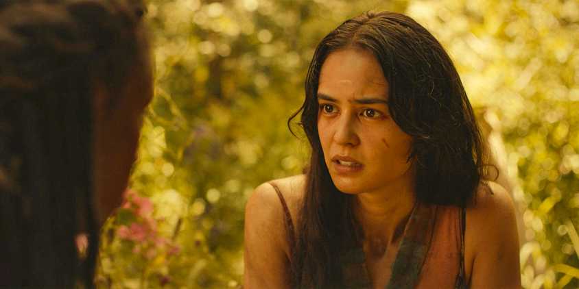 Lottie (Courtney Eaton) looking intently at Akilah (Nia Sondaya) in Yellowjackets Season 3 Ep 4