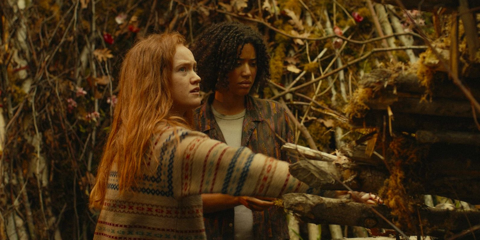 Teen Van (Liv Hewson) and Teen Taissa (Jasmin Savoy Brown) making repairs to the shelter in Yellowjackets Season 3 Ep 6