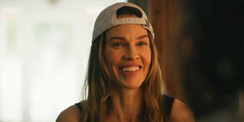 Melissa (Hilary Swank) smiling with tears in her eyes in Yellowjackets Season 3 Episode 8