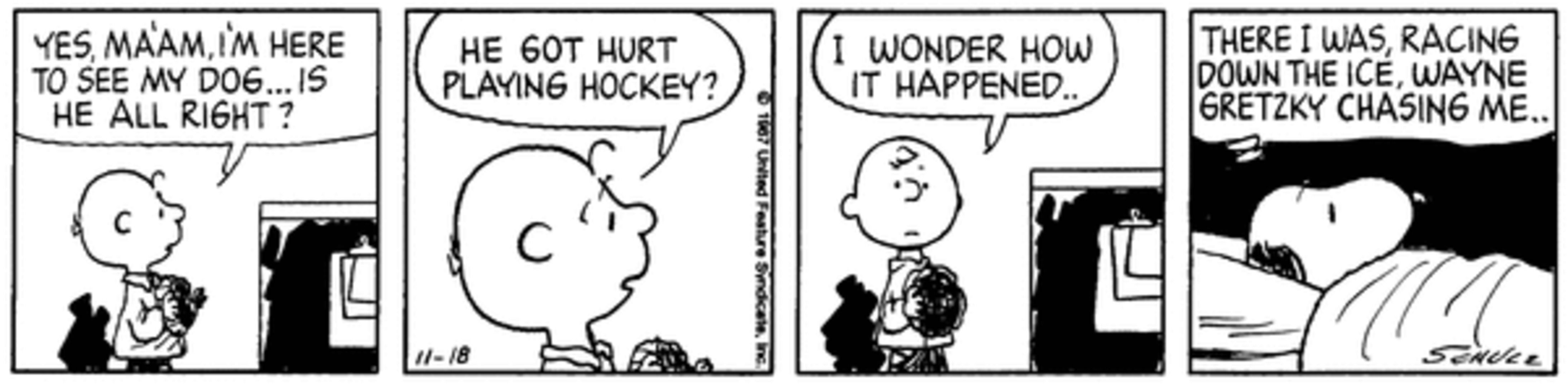 Snoopy in a hospital bed as Charlie Brown visits.