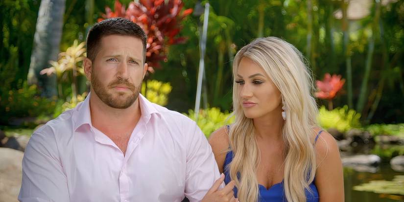 John Thurmond and Kady Krambeer sitting next to each in a confessional on USA Network's Temptation Island season 1