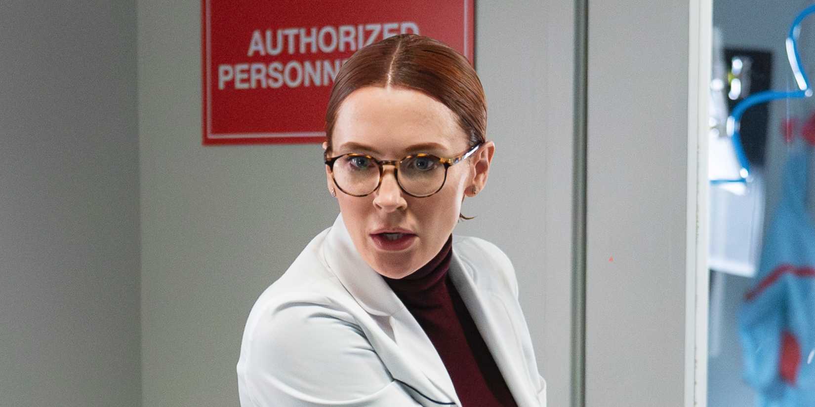 Bridget Regan as Moira in 9-1-1 season 8, episode 14 looking shocked.