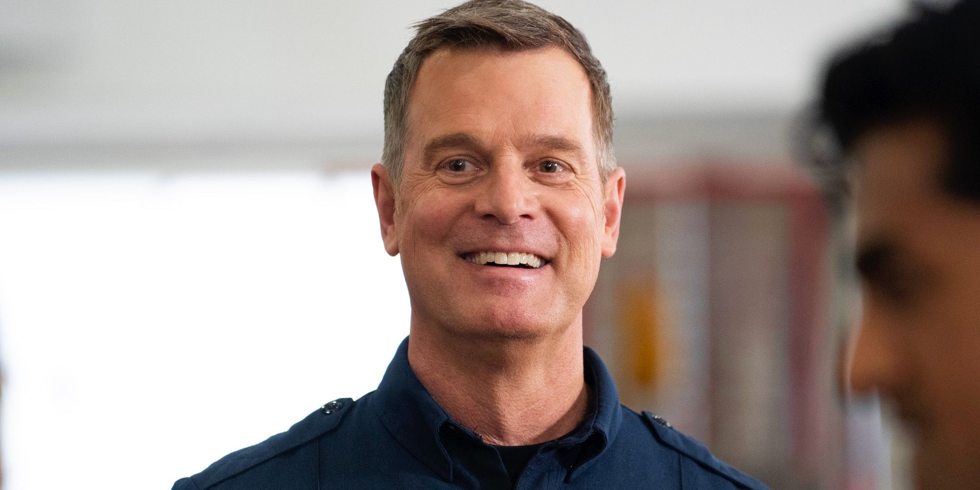 Peter Krause smiling as Bobby Nash in 9-1-1 season 8.