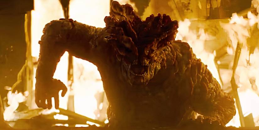 A Bloater rises from the flames in The Last of Us