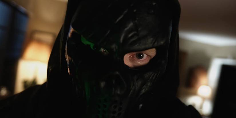 A character wearing a black mask with one eye showing in Criminal Minds Evolution season 18