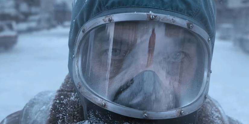 A close-up of a man's face covered by a mask in The Eternaut