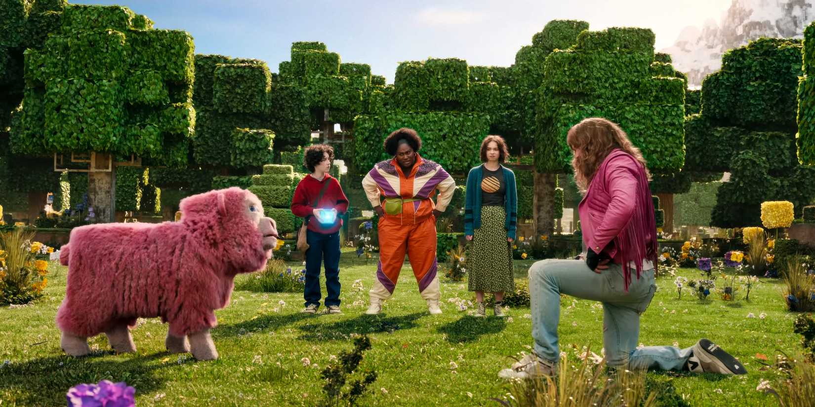 Garrett (Jason Moman) talking to a sheep in A Minecraft Movie